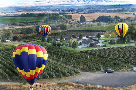 Historic balloon rally scene near a Prosser vineyard